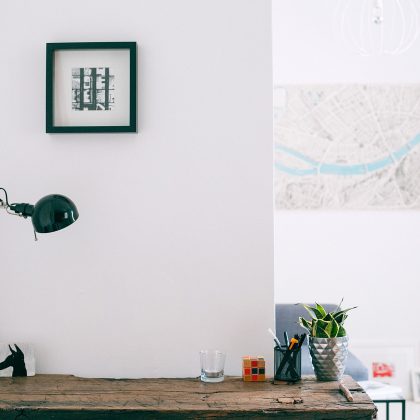 Minimal desk lamp on a wooden workspace